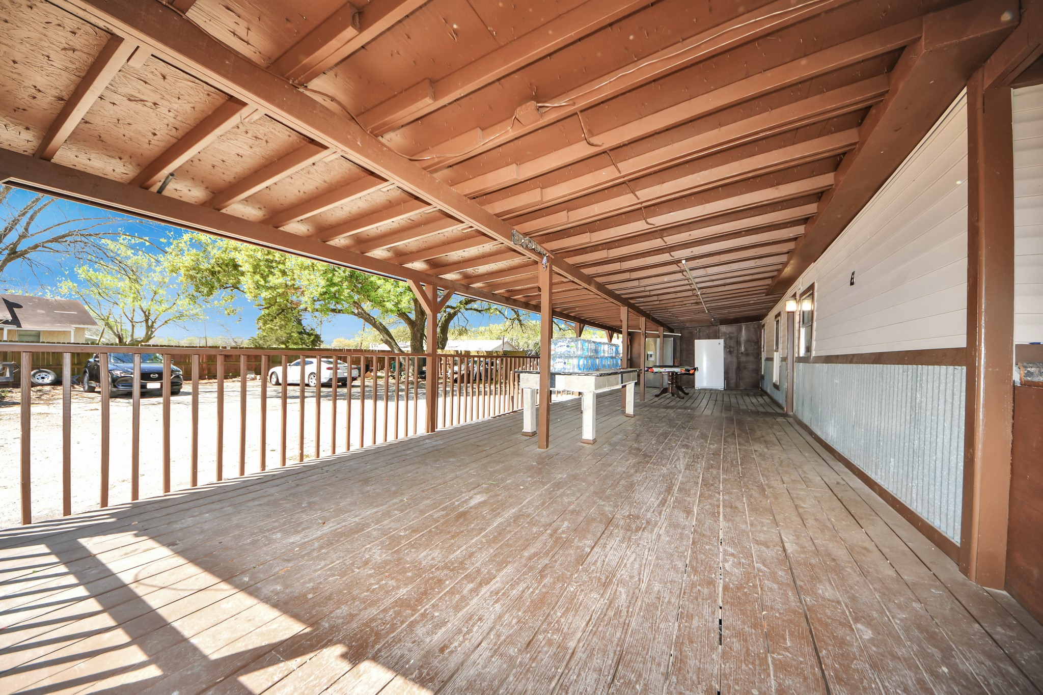 602 Massey Tompkins Road Baytown, TX 77521 - Photo 3 of 15 a view of porch with wooden floor