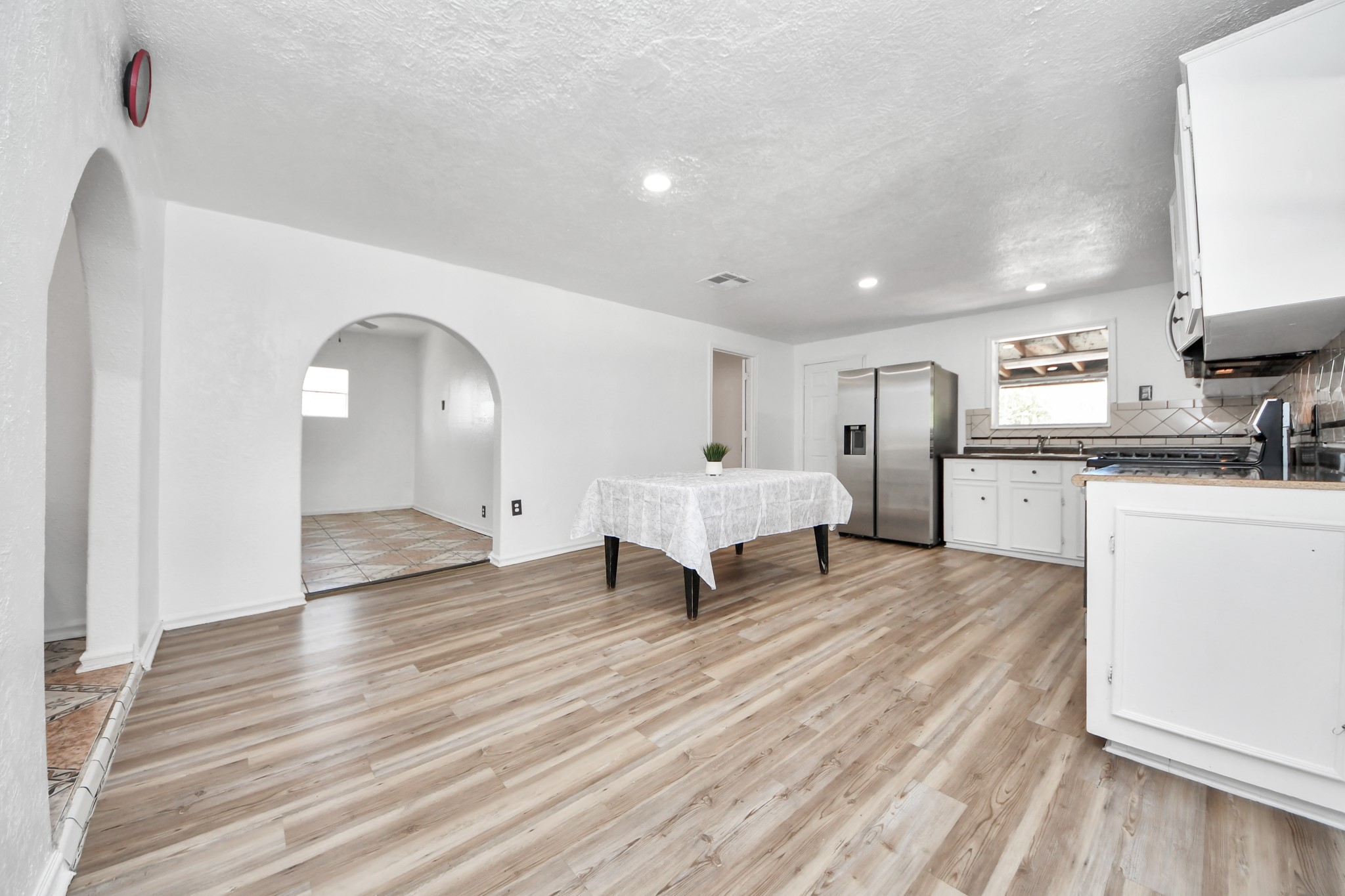 602 Massey Tompkins Road Baytown, TX 77521 - Photo 4 of 15 a spacious bedroom with a bed and a sink