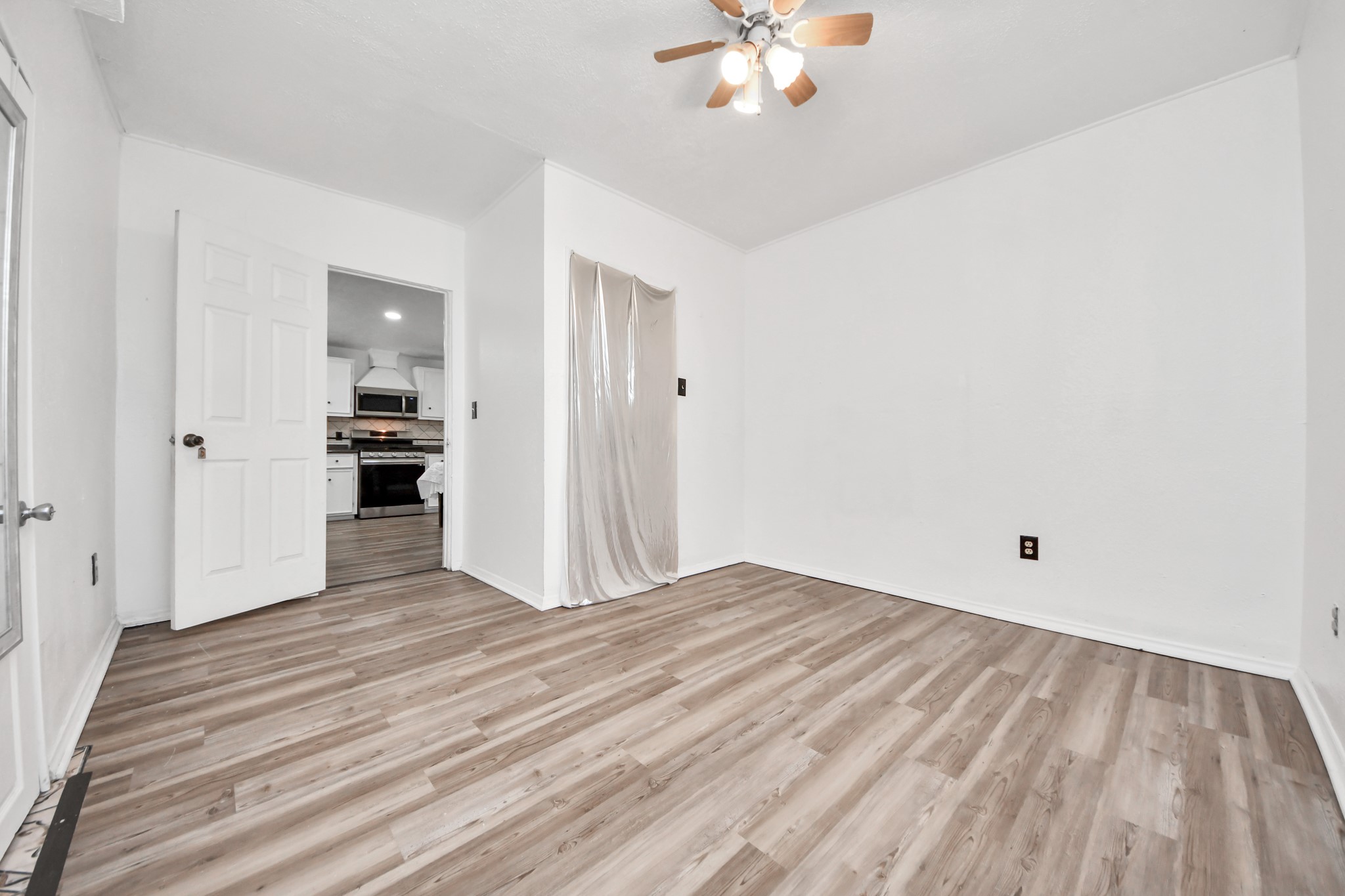 602 Massey Tompkins Road Baytown, TX 77521 - Photo 6 of 15 a view of empty room with wooden floor