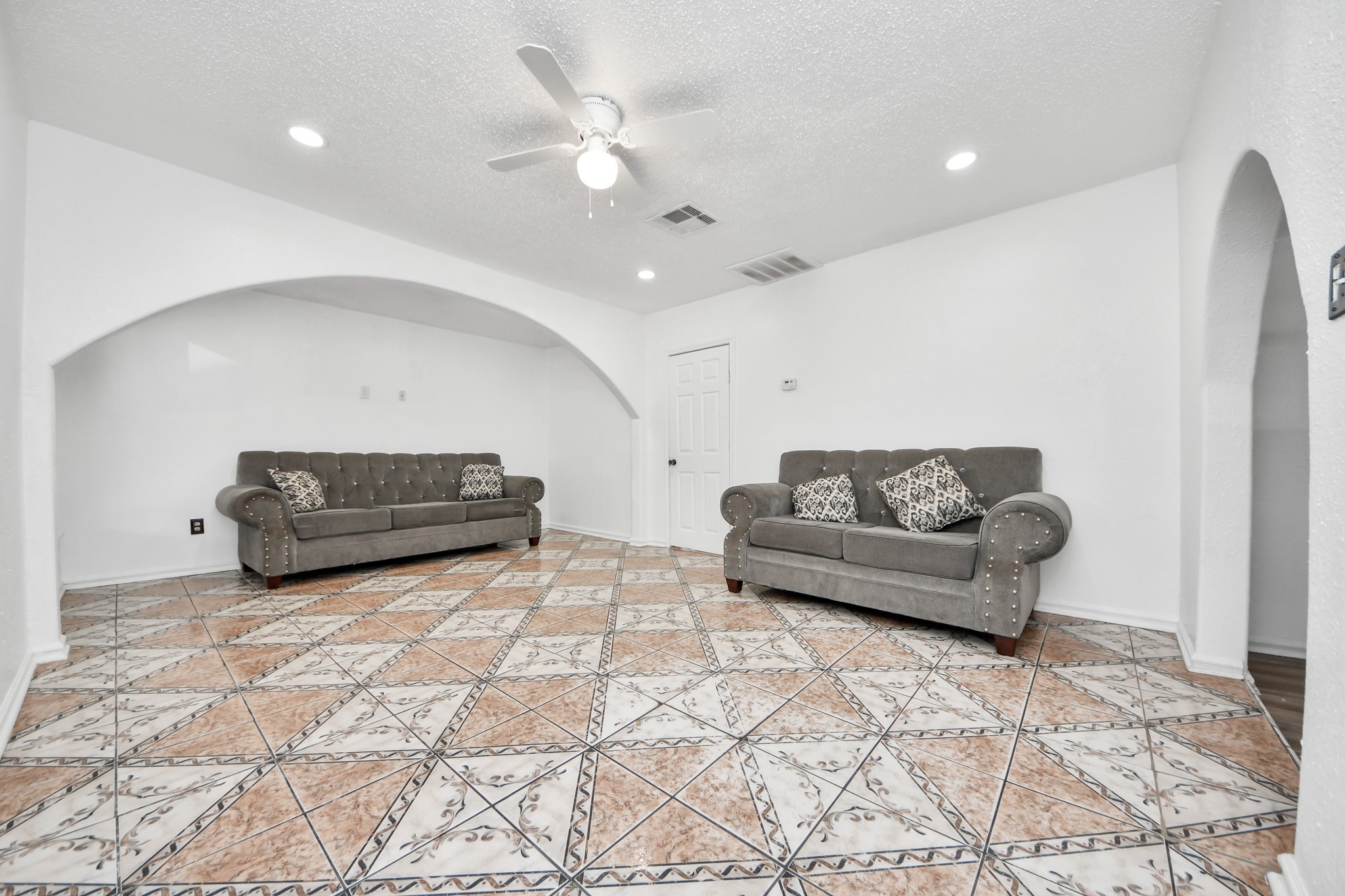 602 Massey Tompkins Road Baytown, TX 77521 - Photo 7 of 15 a living room with furniture and a chandelier