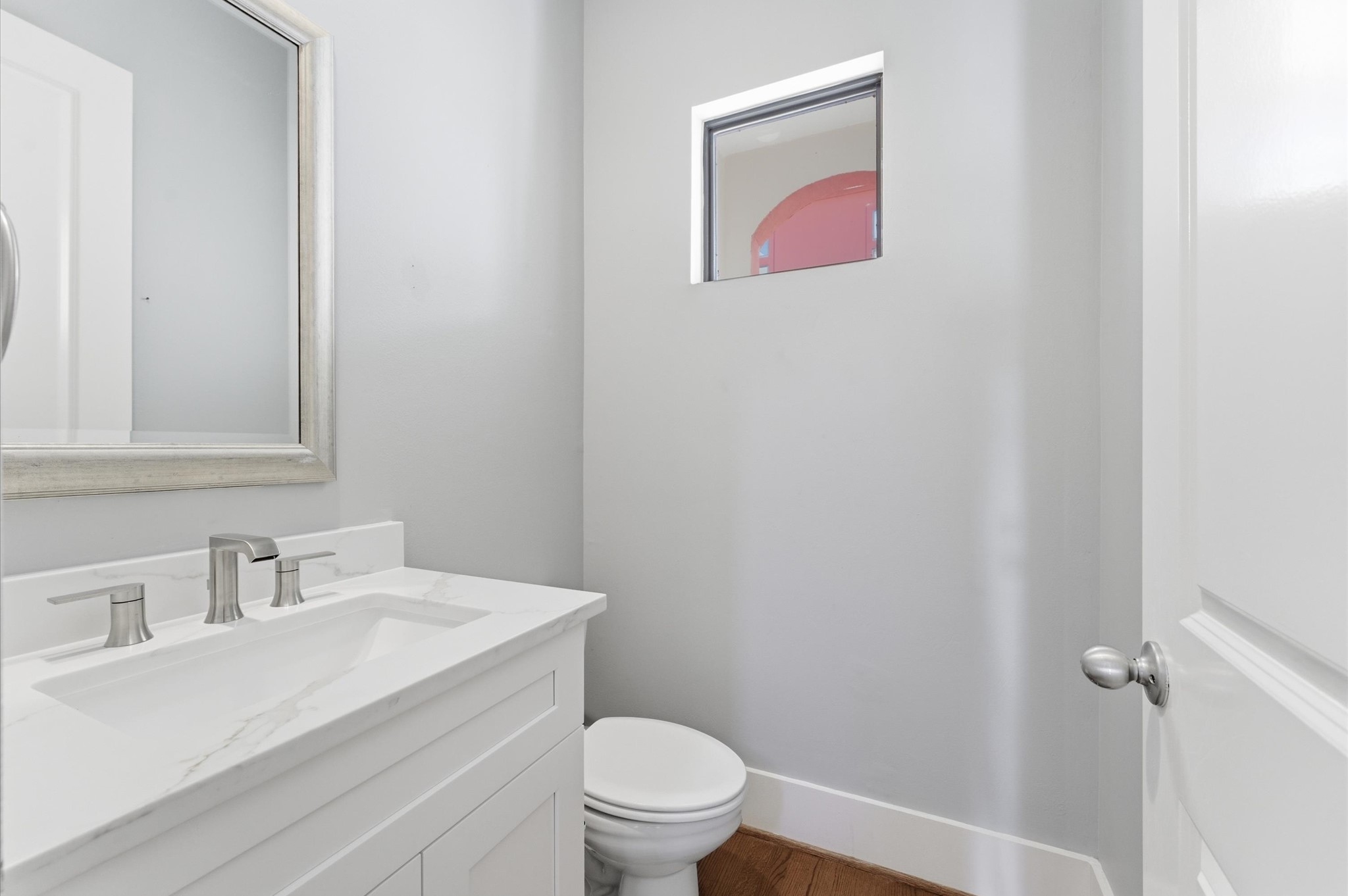 408 Parker Street Houston, TX 77007 - Photo 15 of 27 a bathroom with a sink mirror vanity and toilet