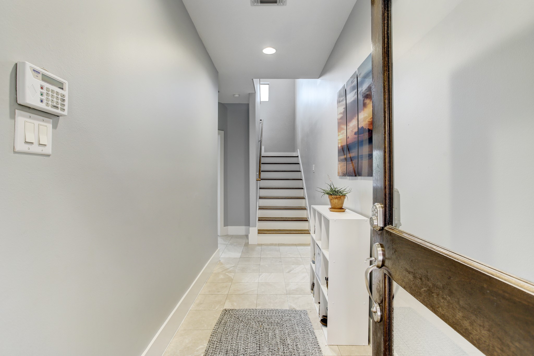 408 Parker Street Houston, TX 77007 - Photo 3 of 27 a view of entryway with stairs and wooden floor