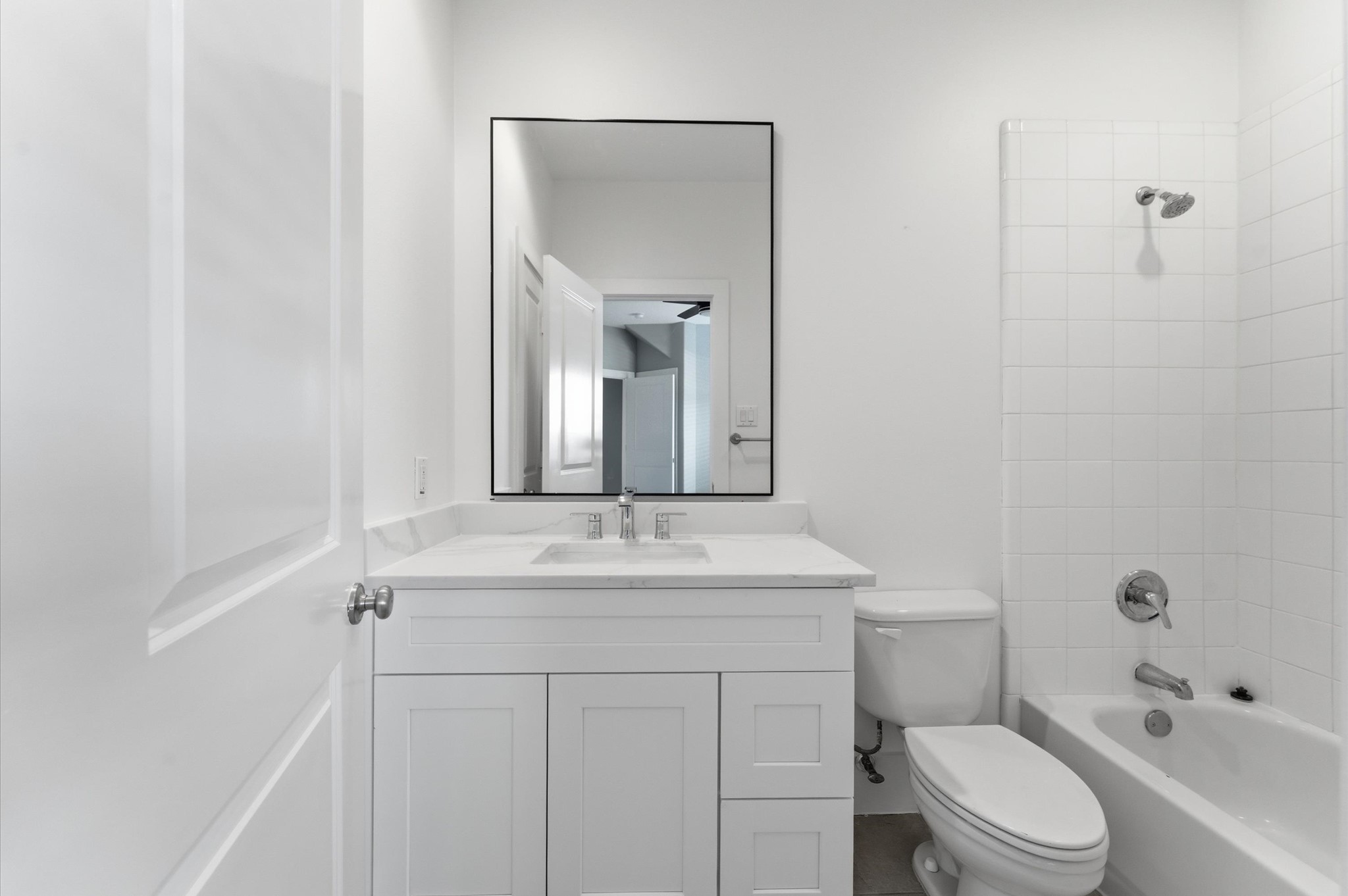 408 Parker Street Houston, TX 77007 - Photo 6 of 27 a bathroom with a sink toilet vanity and shower