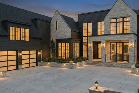 a front view of a house with a garage