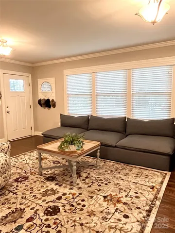 a living room with furniture window and a table