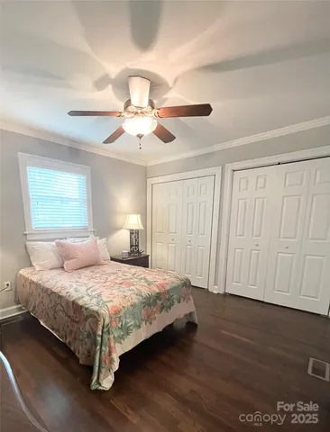 a bathroom with a toilet a sink a vanity and mirror