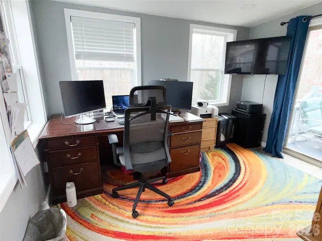 a room with furniture and a flat screen tv