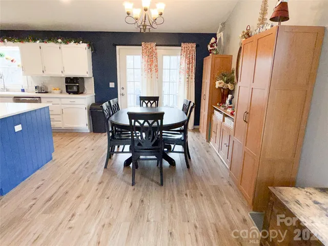 a view of a dining room with furniture and window