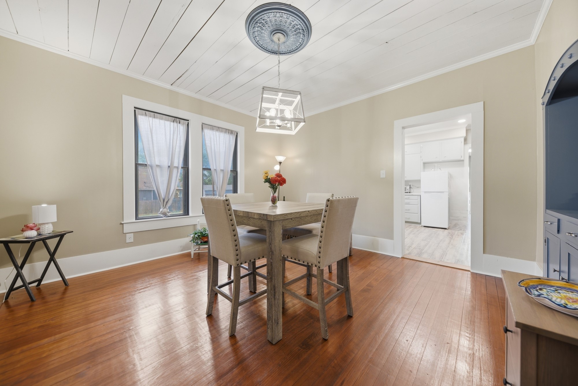 1501 South Austin Street Brenham, TX 77833 - Photo 11 of 36 a view of a dining room with furniture wooden floor and a chandelier