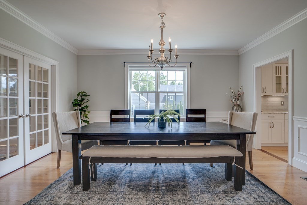 427 Davis Road Bedford, MA 01730 - Photo 14 of 42 a view of a dining room with furniture window and wooden floor