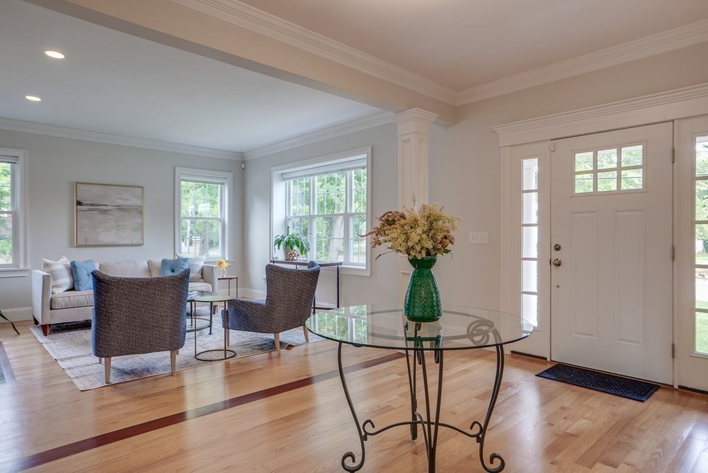 427 Davis Road Bedford, MA 01730 - Photo 19 of 42 a living room with furniture potted plant and windows