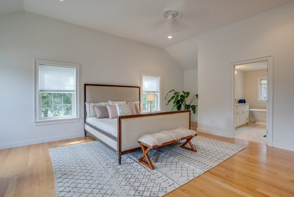 427 Davis Road Bedford, MA 01730 - Photo 22 of 42 a living room with furniture and a rug