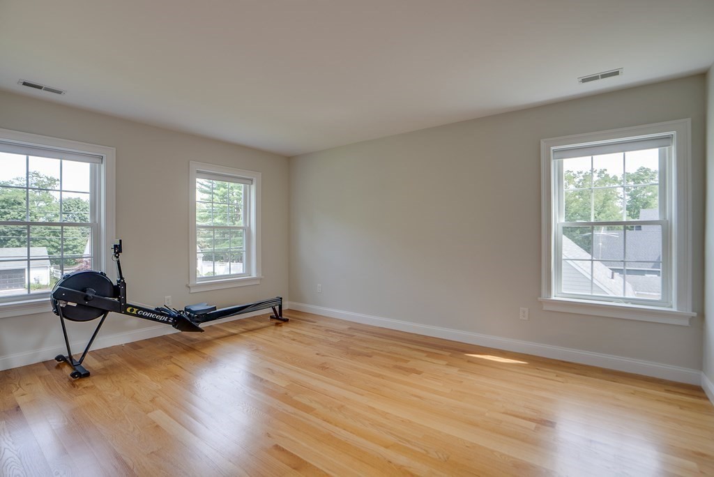 427 Davis Road Bedford, MA 01730 - Photo 29 of 42 a room with window wooden floor and windows