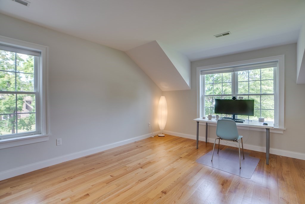 427 Davis Road Bedford, MA 01730 - Photo 30 of 42 a workspace with wooden floor and a window