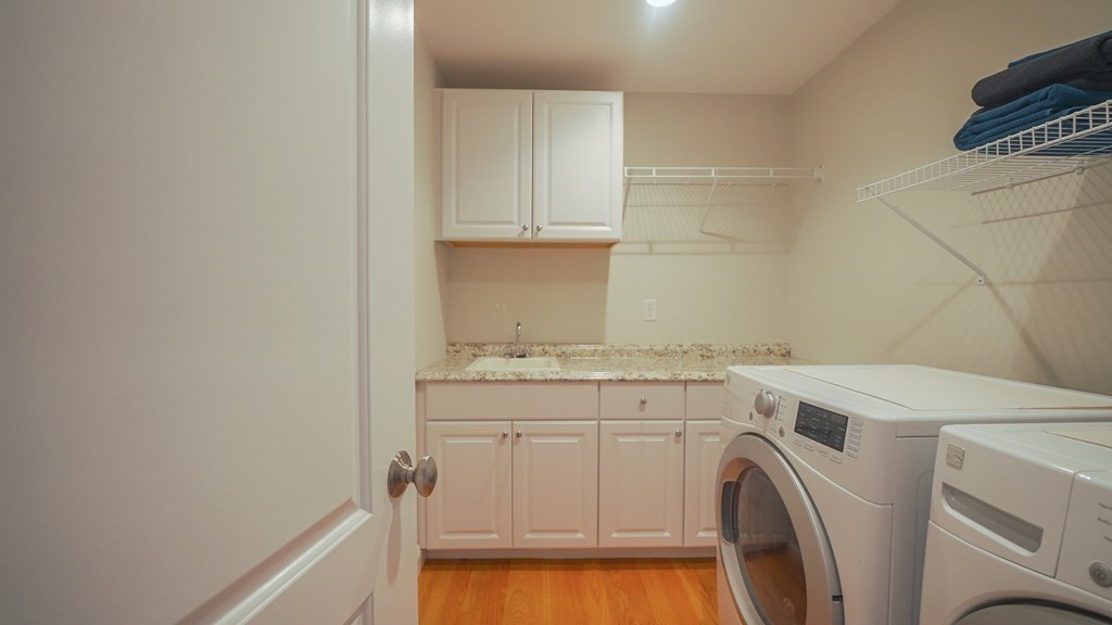 427 Davis Road Bedford, MA 01730 - Photo 34 of 42 a utility room with dryer and washer