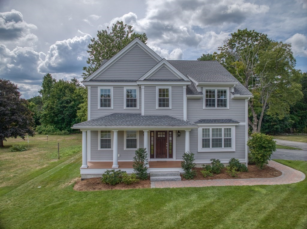 427 Davis Road Bedford, MA 01730 - Photo 36 of 42 a front view of a house with a yard