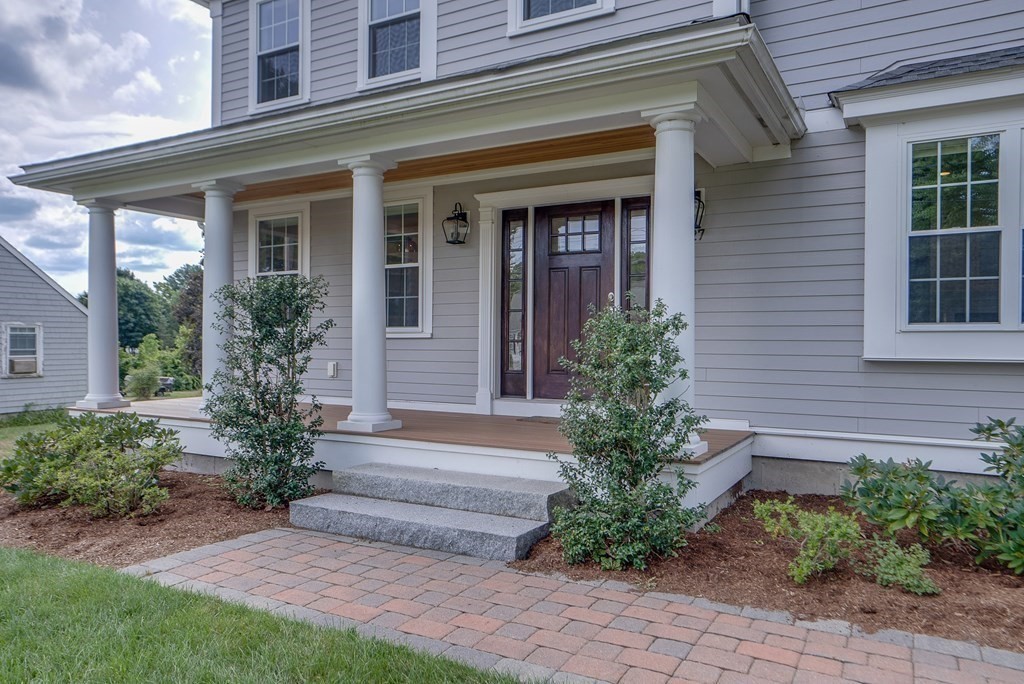 427 Davis Road Bedford, MA 01730 - Photo 37 of 42 a front view of a house with garden