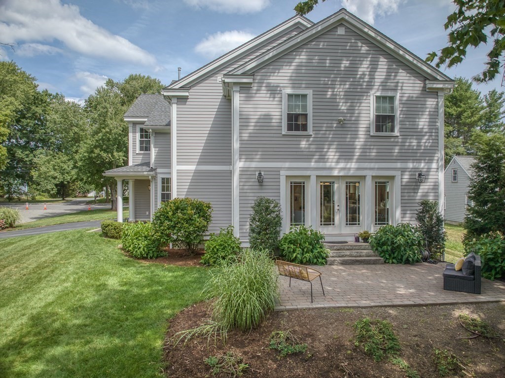 427 Davis Road Bedford, MA 01730 - Photo 41 of 42 a front view of a house with a yard