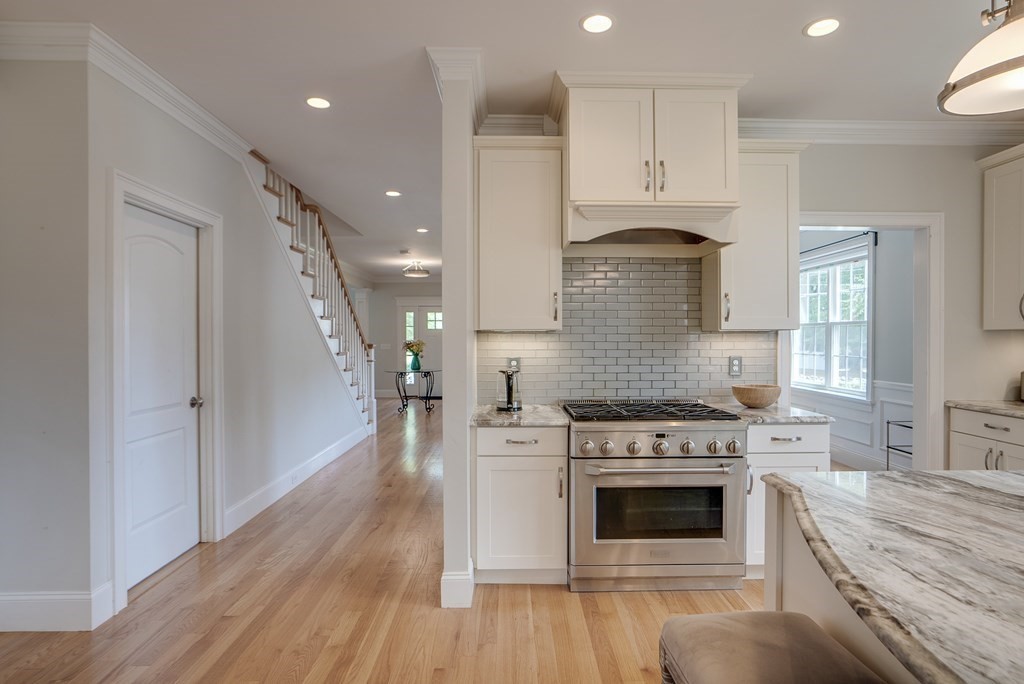 427 Davis Road Bedford, MA 01730 - Photo 8 of 42 a kitchen with a stove oven and sink