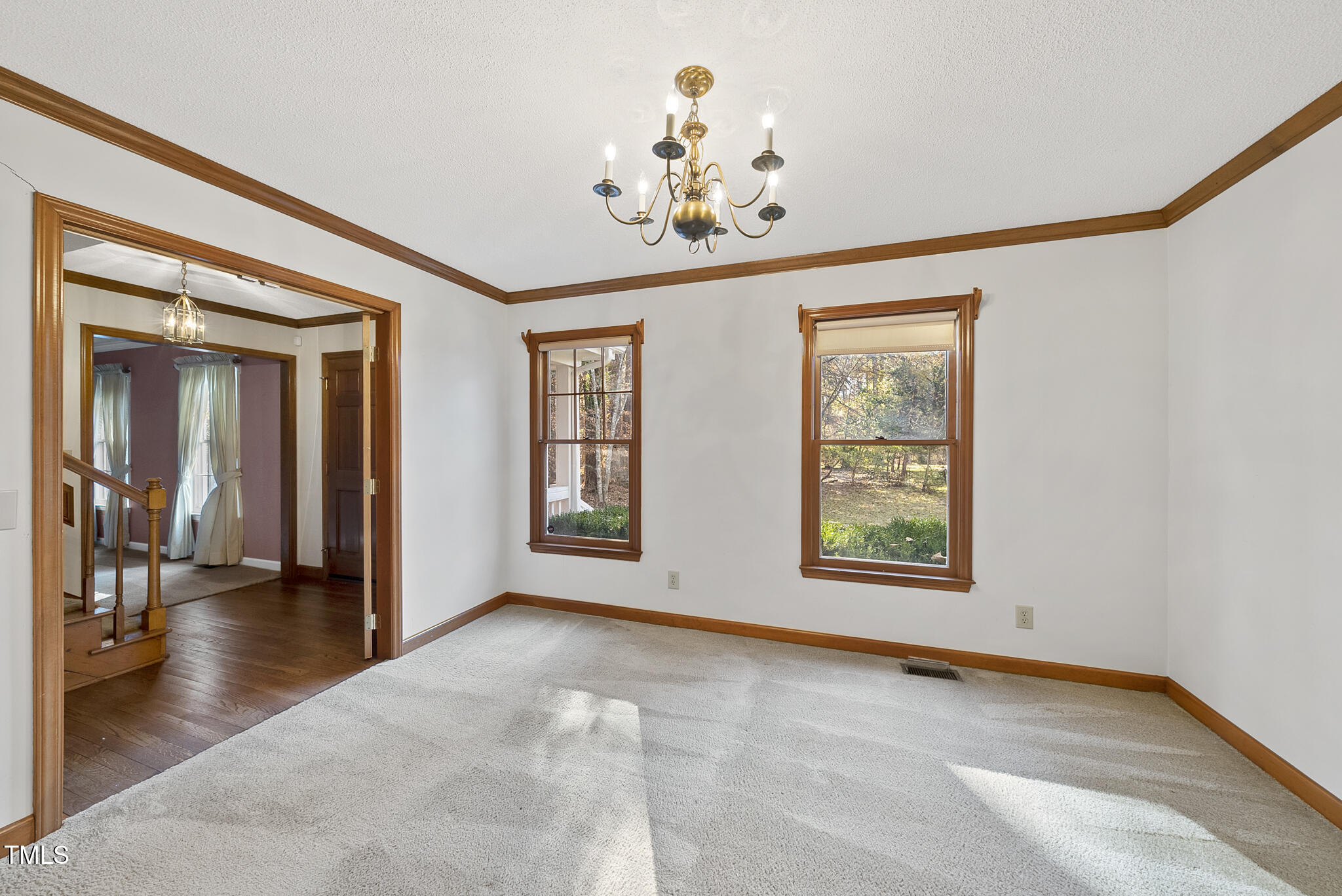 12012 Strickland Road Raleigh, NC 27613 - Photo 17 of 45 a view of an empty room with a window