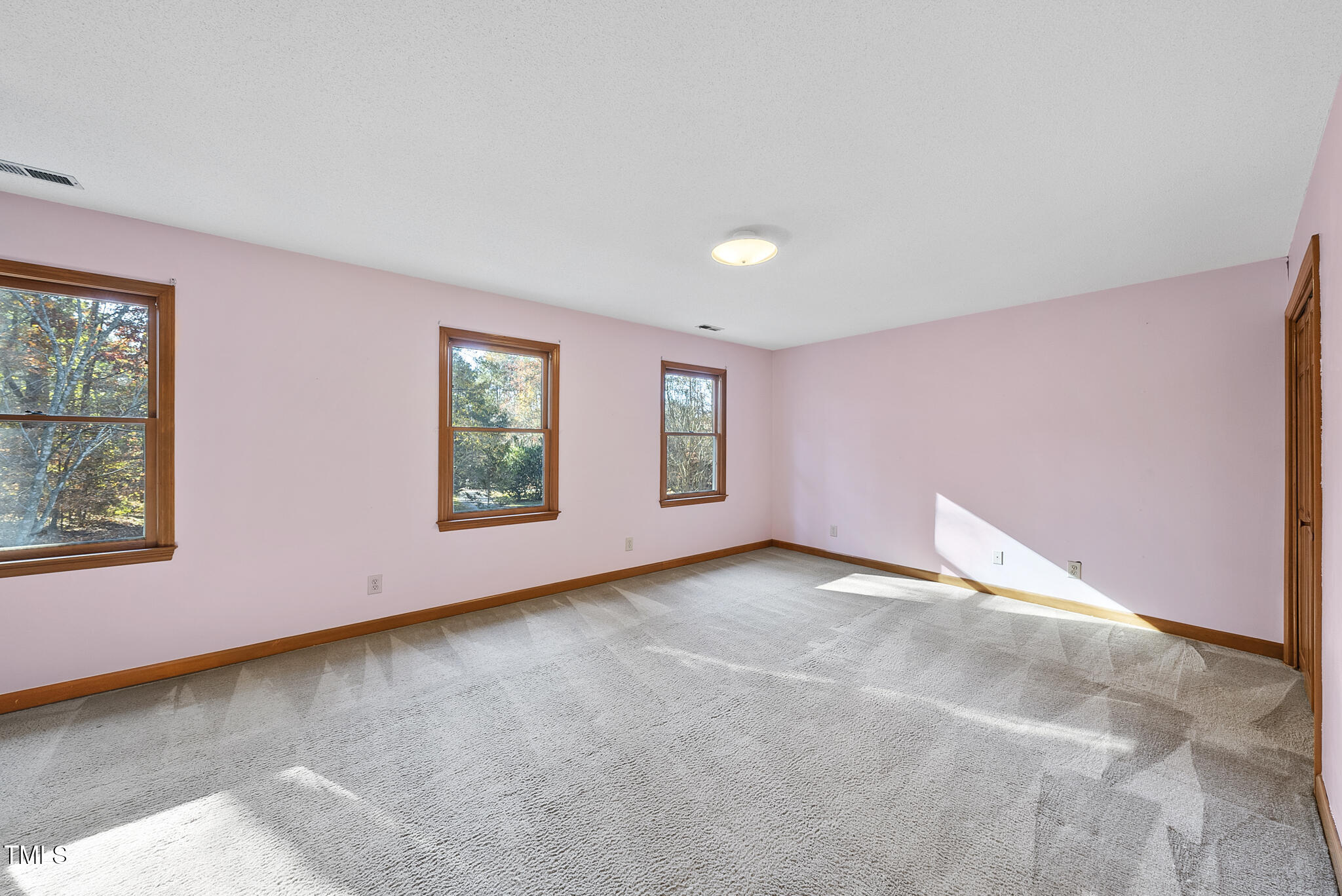 12012 Strickland Road Raleigh, NC 27613 - Photo 30 of 45 a view of an empty room with a window