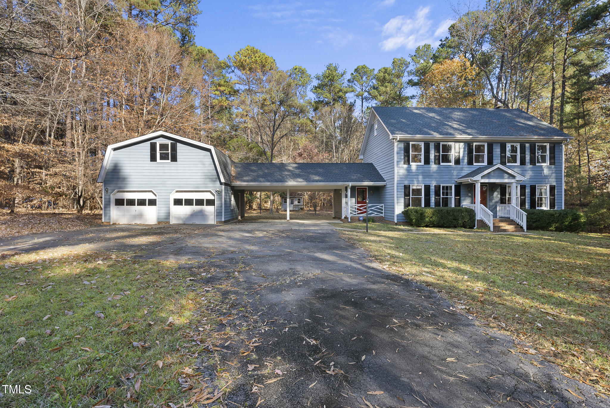 12012 Strickland Road Raleigh, NC 27613 - Photo 3 of 45 a front view of a house with a yard