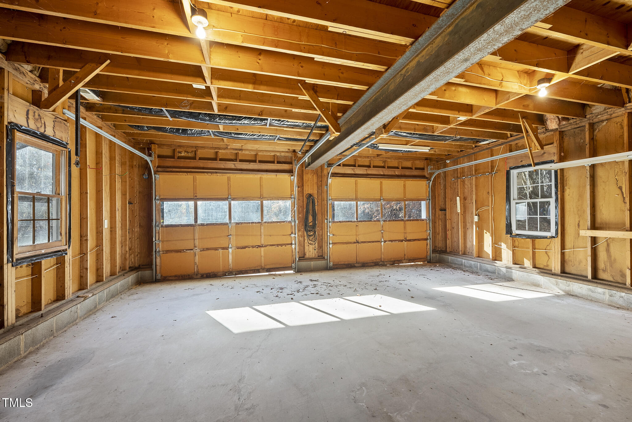 12012 Strickland Road Raleigh, NC 27613 - Photo 38 of 45 a view of a room with racks on the wall
