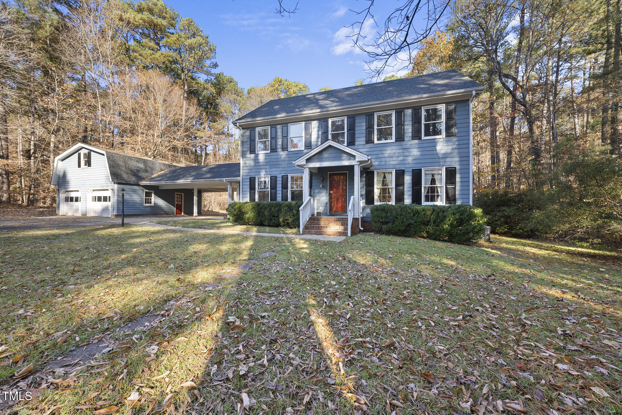 12012 Strickland Road Raleigh, NC 27613 - Photo 4 of 45 a front view of a house with a yard