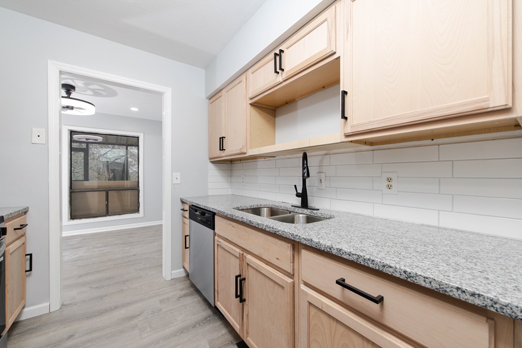 4312 Old Macon Road, Unit 56 Columbus, GA 31907 - Photo 10 of 19 a kitchen with stainless steel appliances granite countertop a sink and a white cabinets