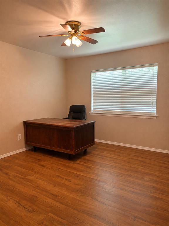5355 Banks Road Fort Worth, TX 76140 - Photo 19 of 29 a living room with hard wood floors and a ceiling fan