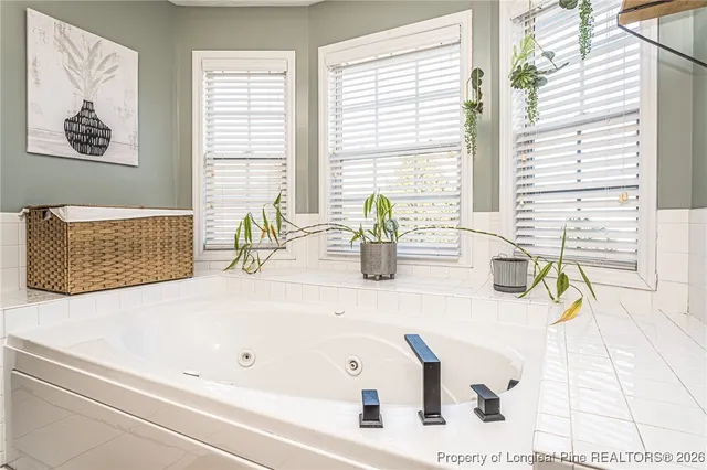 a bathroom with a sink double vanity and a mirror