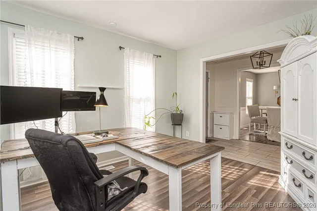 a kitchen with stainless steel appliances a stove sink microwave and cabinets
