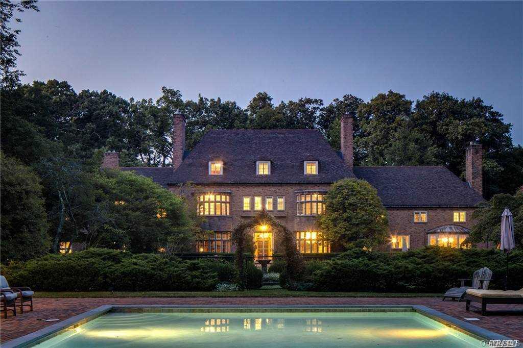 a view of swimming pool and trees in the background