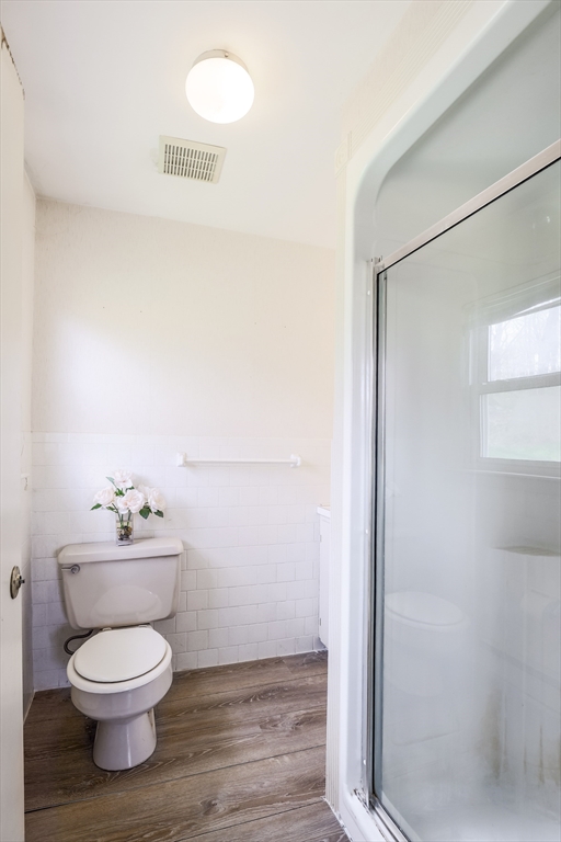 6 Lerner Drive Dudley, MA 01571 - Photo 16 of 22 a bathroom with a toilet a sink and a mirror