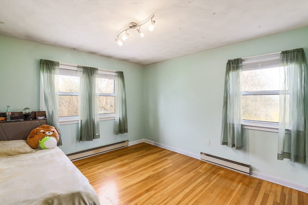 6 Lerner Drive Dudley, MA 01571 - Photo 18 of 22 a bedroom with a bed and window