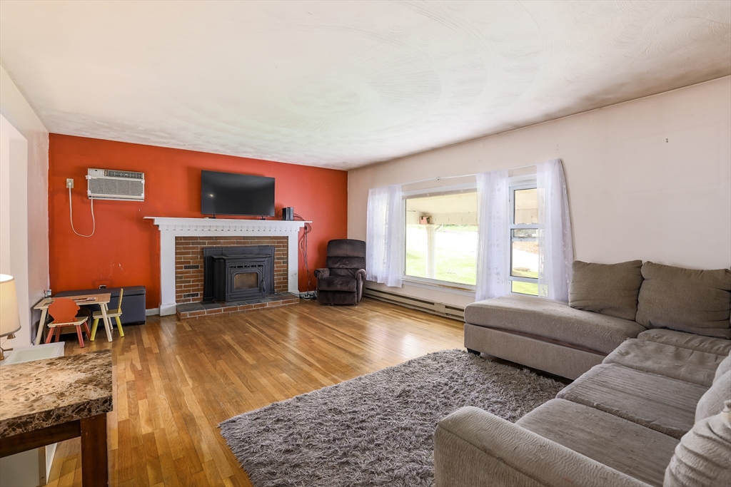 6 Lerner Drive Dudley, MA 01571 - Photo 7 of 22 a living room with furniture and a fireplace