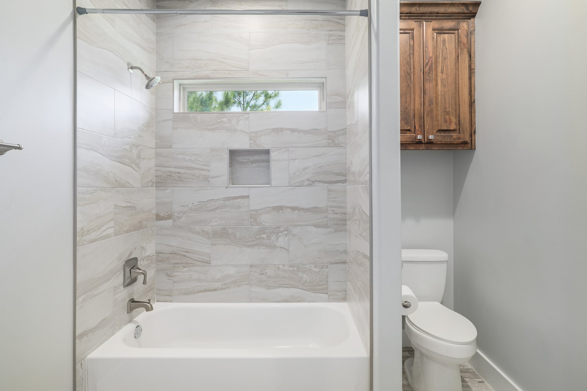 258 County Road Bastrop, TX 78602 - Photo 19 of 32 a bathroom with a bathtub and a toilet