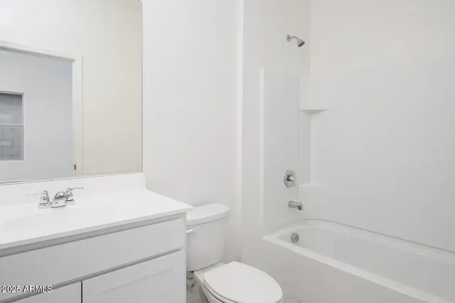 a bathroom with a sink toilet and bathtub