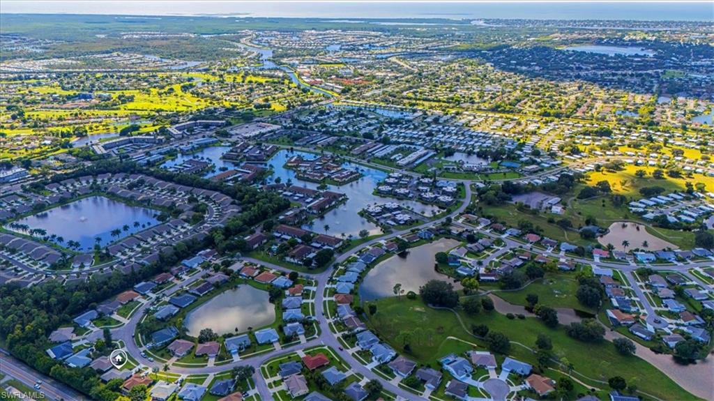124 Versailles Circle Naples, FL 34112 - Photo 20 of 21 an aerial view of residential houses with outdoor space