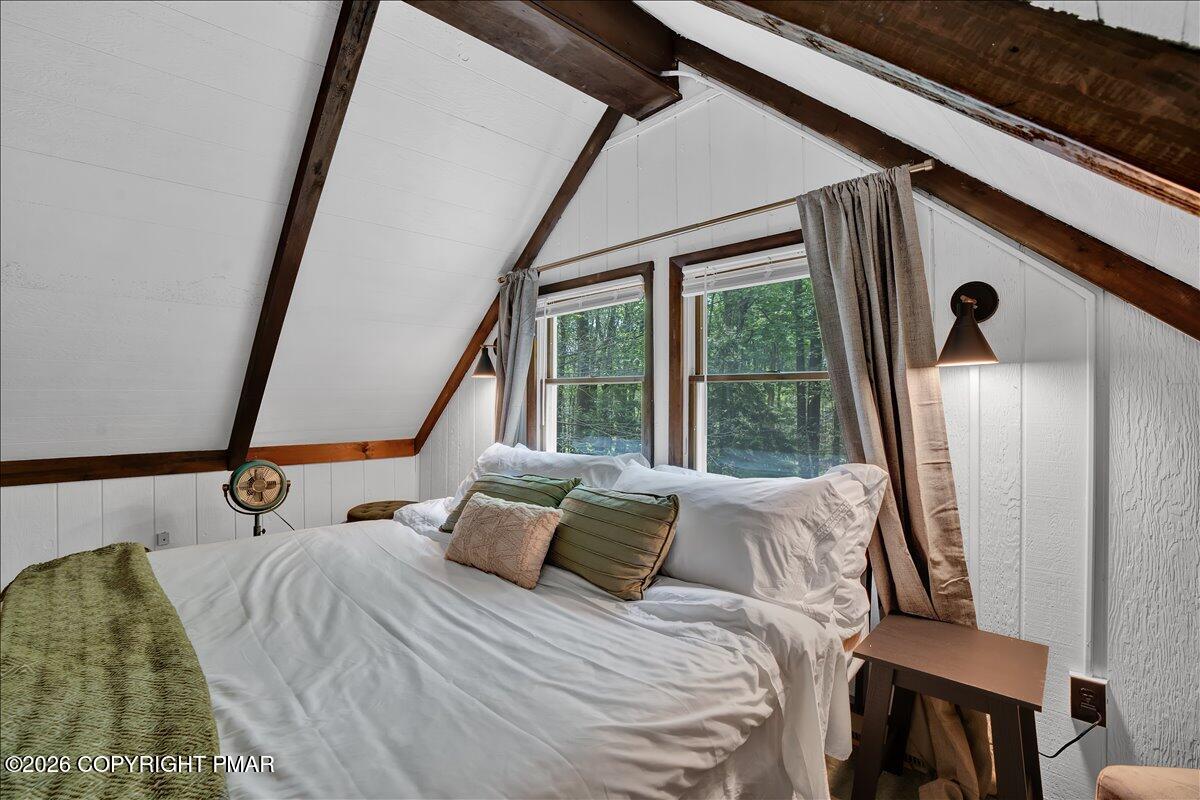 58 Sheffick Road, Unit E743 Gouldsboro, PA 18424 - Photo 20 of 44 a bed sitting in a bedroom next to a window