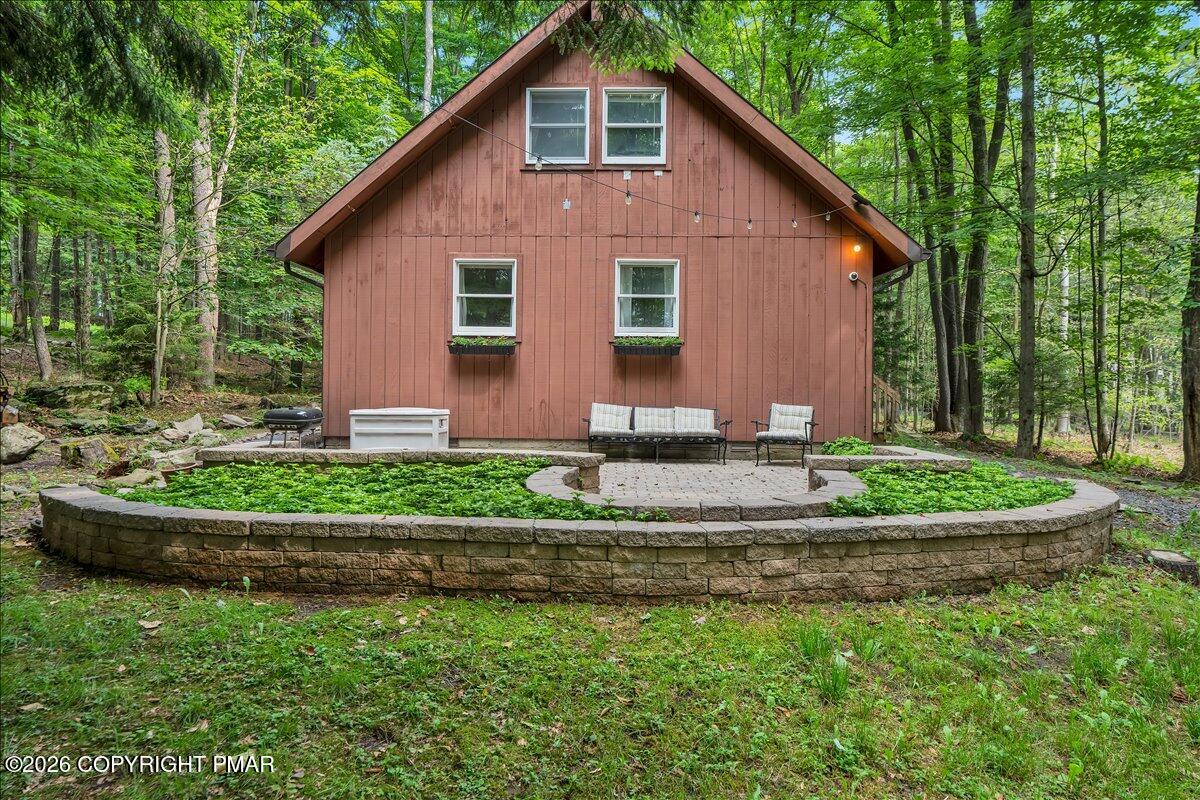 58 Sheffick Road, Unit E743 Gouldsboro, PA 18424 - Photo 29 of 44 a front view of a house with a yard and potted plants