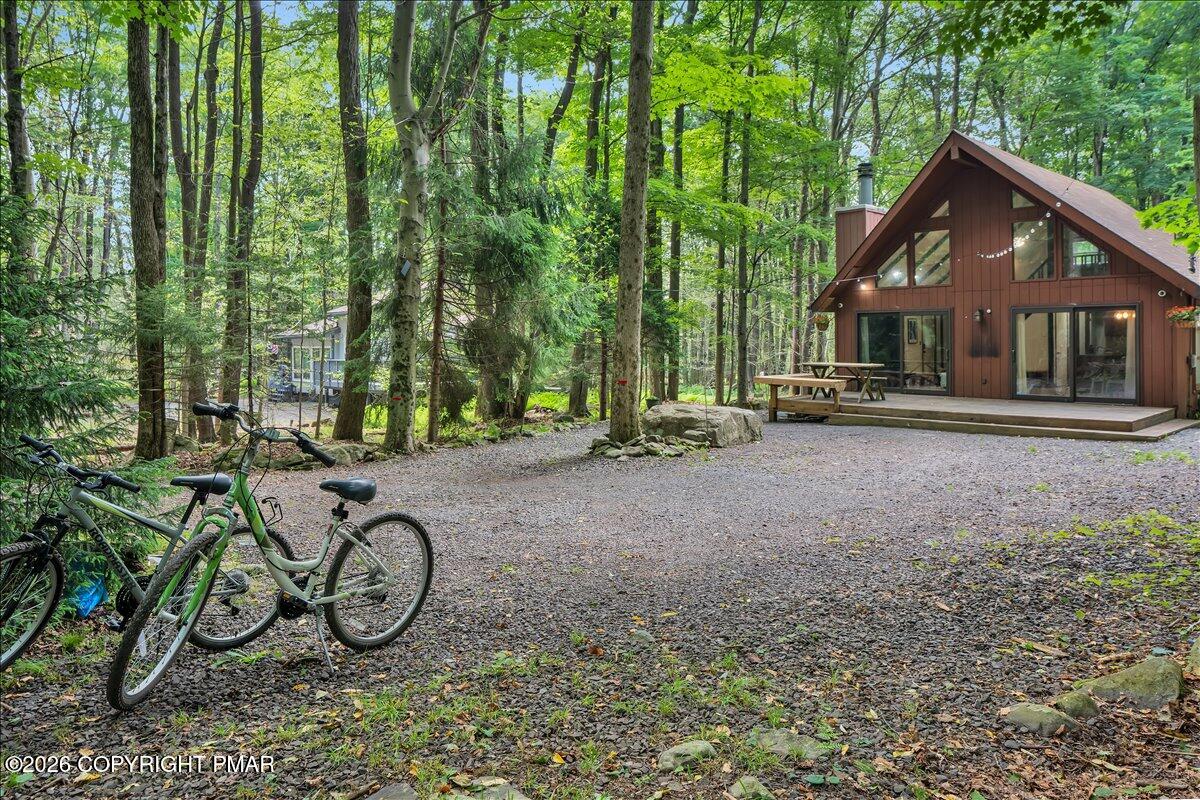 58 Sheffick Road, Unit E743 Gouldsboro, PA 18424 - Photo 32 of 44 a view of a house with large trees and a yard