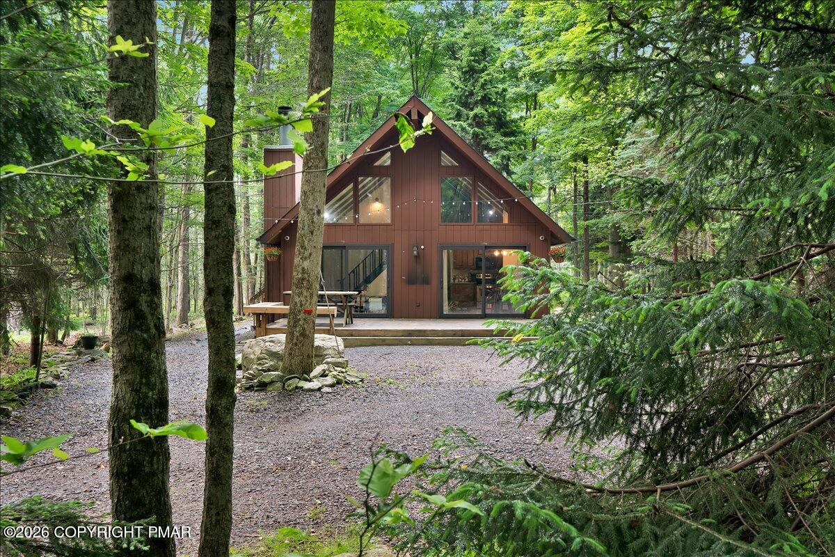 58 Sheffick Road, Unit E743 Gouldsboro, PA 18424 - Photo 35 of 44 a view of house with yard and sitting area