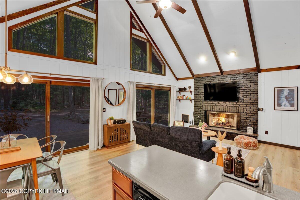 58 Sheffick Road, Unit E743 Gouldsboro, PA 18424 - Photo 37 of 44 a living room with furniture a flat screen tv and a fireplace