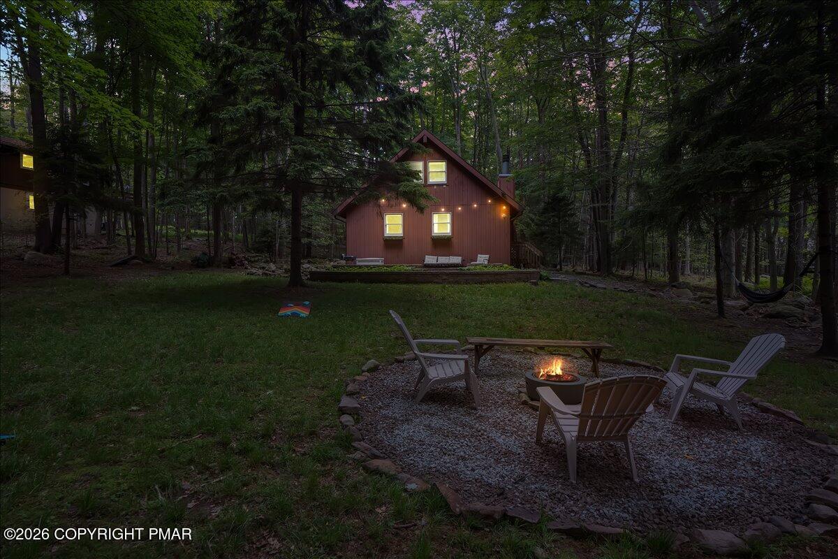 58 Sheffick Road, Unit E743 Gouldsboro, PA 18424 - Photo 38 of 44 a backyard of a house with table and chairs