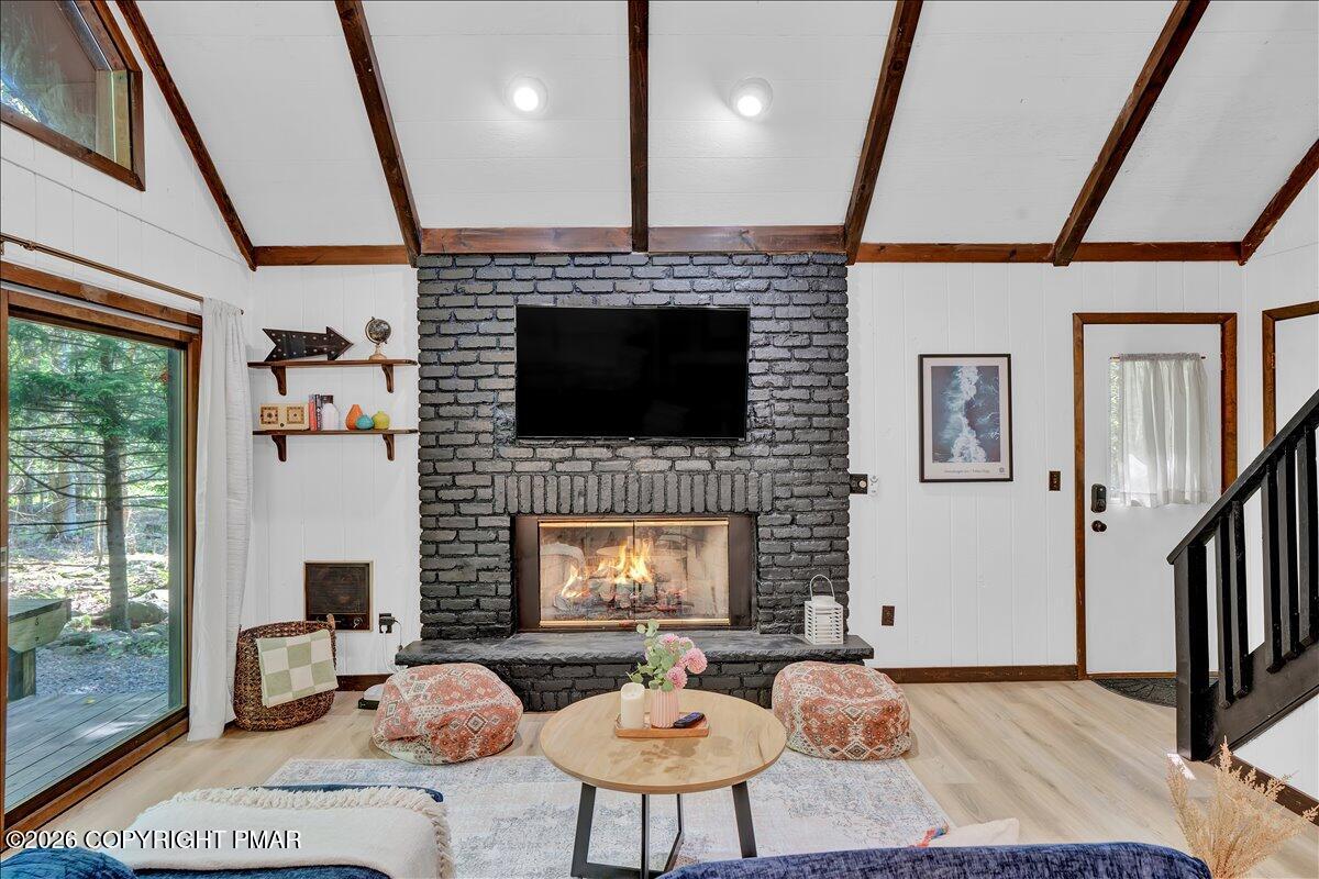 58 Sheffick Road, Unit E743 Gouldsboro, PA 18424 - Photo 42 of 44 a living room with furniture and a fireplace