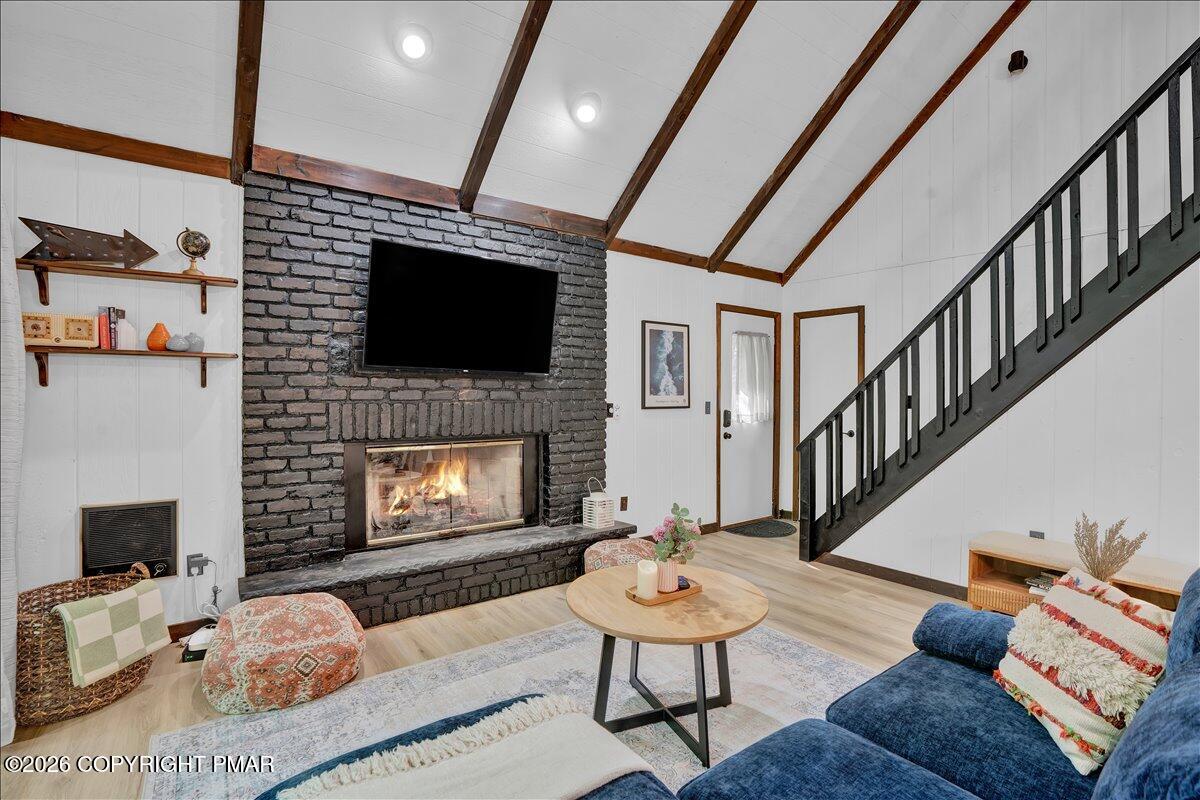 58 Sheffick Road, Unit E743 Gouldsboro, PA 18424 - Photo 43 of 44 a living room with furniture a flat screen tv and a fireplace