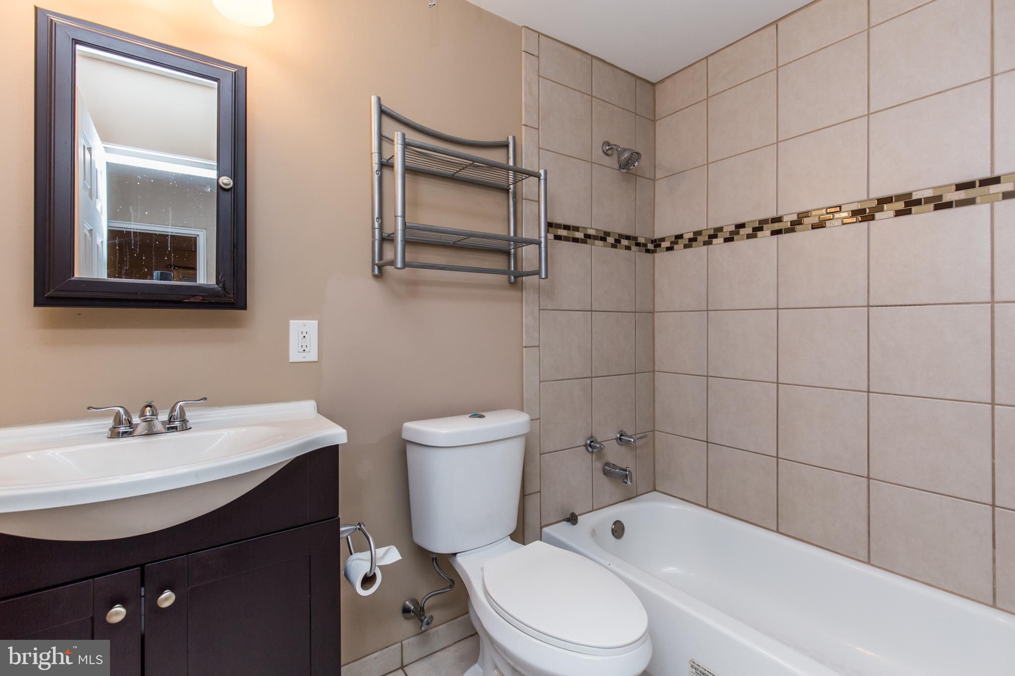 2757 East Country Club Road, Unit 2 Philadelphia, PA 19131 - Photo 11 of 24 a bathroom with a sink toilet and shower