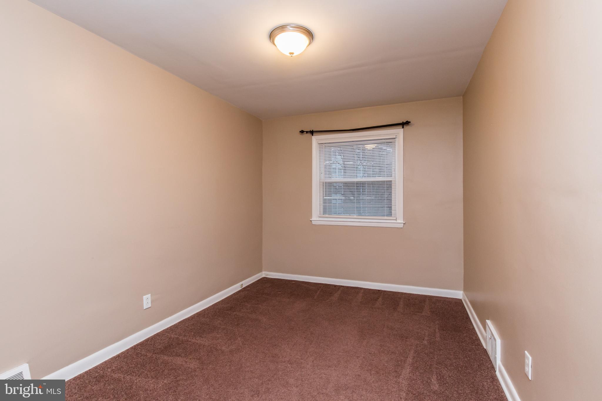 2757 East Country Club Road, Unit 2 Philadelphia, PA 19131 - Photo 15 of 24 an empty room with a window