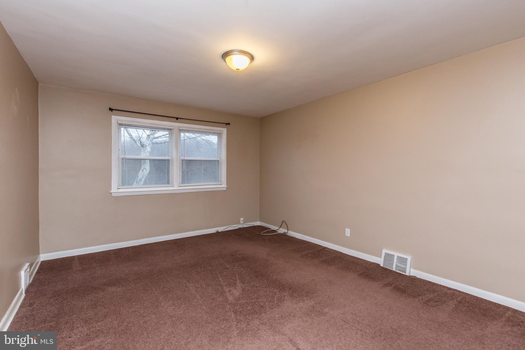 2757 East Country Club Road, Unit 2 Philadelphia, PA 19131 - Photo 18 of 24 an empty room with a window